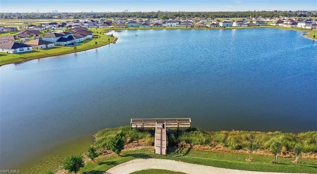 an aerial view of a house with a lake view