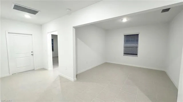 a bathroom with a granite countertop sink a toilet and bathtub