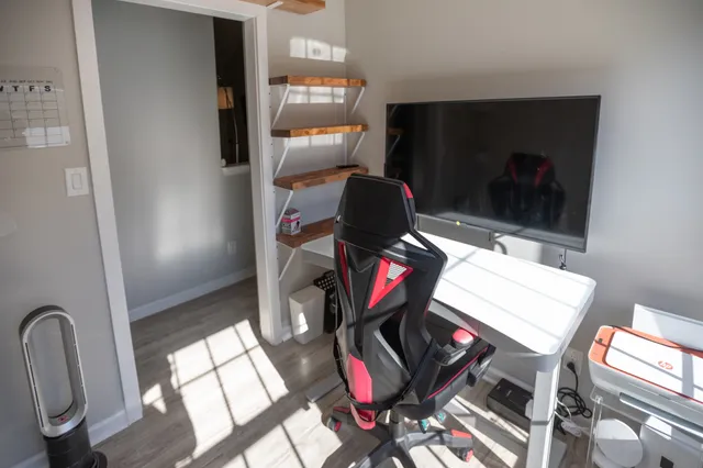 a bathroom with a granite countertop sink a toilet and mirror