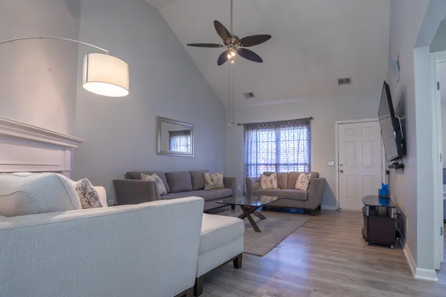 a living room with furniture and a window