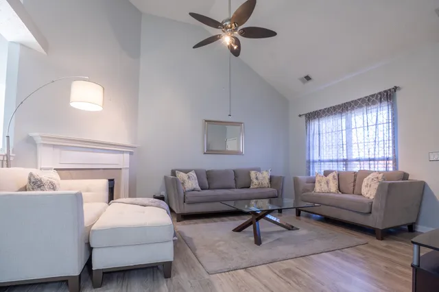 a living room with furniture and a window