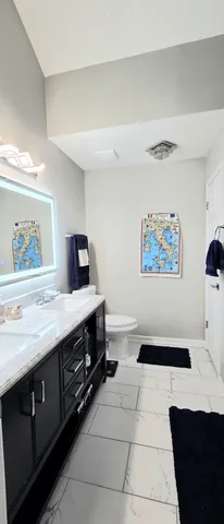 a spacious bathroom with a sink a mirror and a bathtub