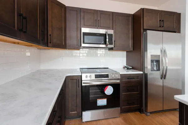 a kitchen with a stove microwave and refrigerator