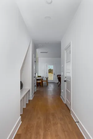 a living room with furniture and a view of bedroom