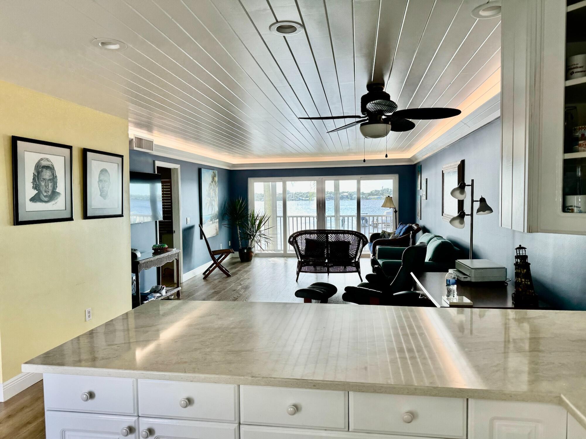 1868 Southwest Palm City Road, Unit 202 Stuart, FL 34994 - Photo 8 of 18 a living room with furniture and a large window