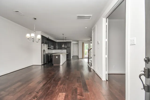 a view of a kitchen and a stove top oven
