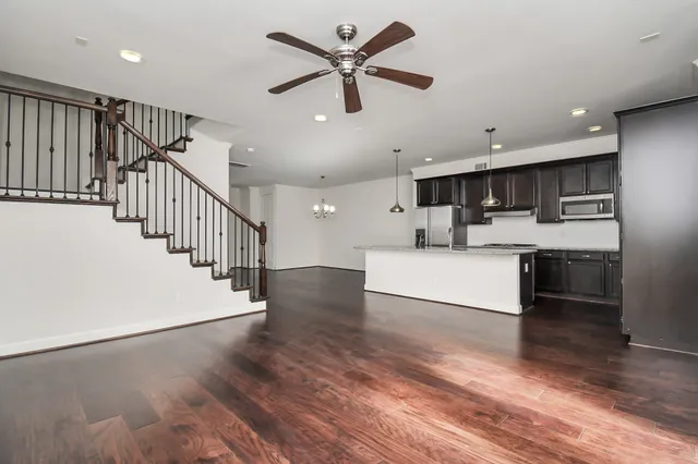 a view of kitchen with cabinets and wooden floor