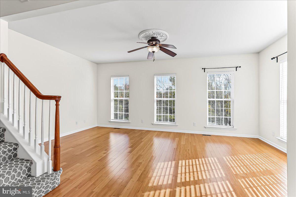1910 Cavalier Lane Chester Springs, PA 19425 - Photo 11 of 32 a view of an empty room with wooden floor and a window