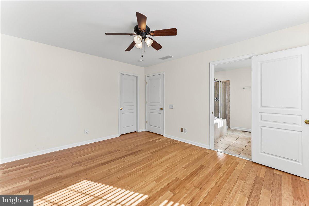 1910 Cavalier Lane Chester Springs, PA 19425 - Photo 20 of 32 a view of empty room with wooden floor