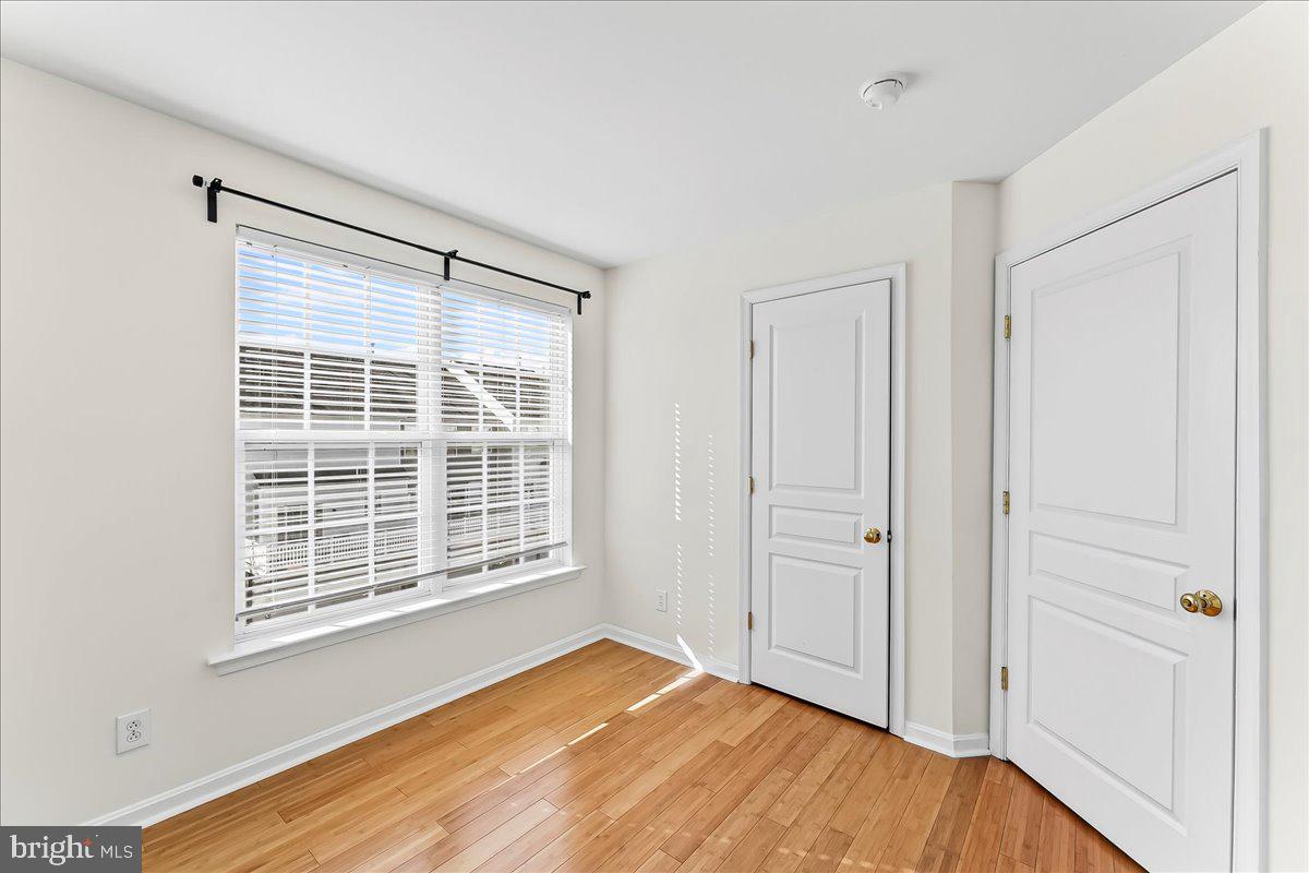1910 Cavalier Lane Chester Springs, PA 19425 - Photo 22 of 32 a view of an empty room with wooden floor and a window