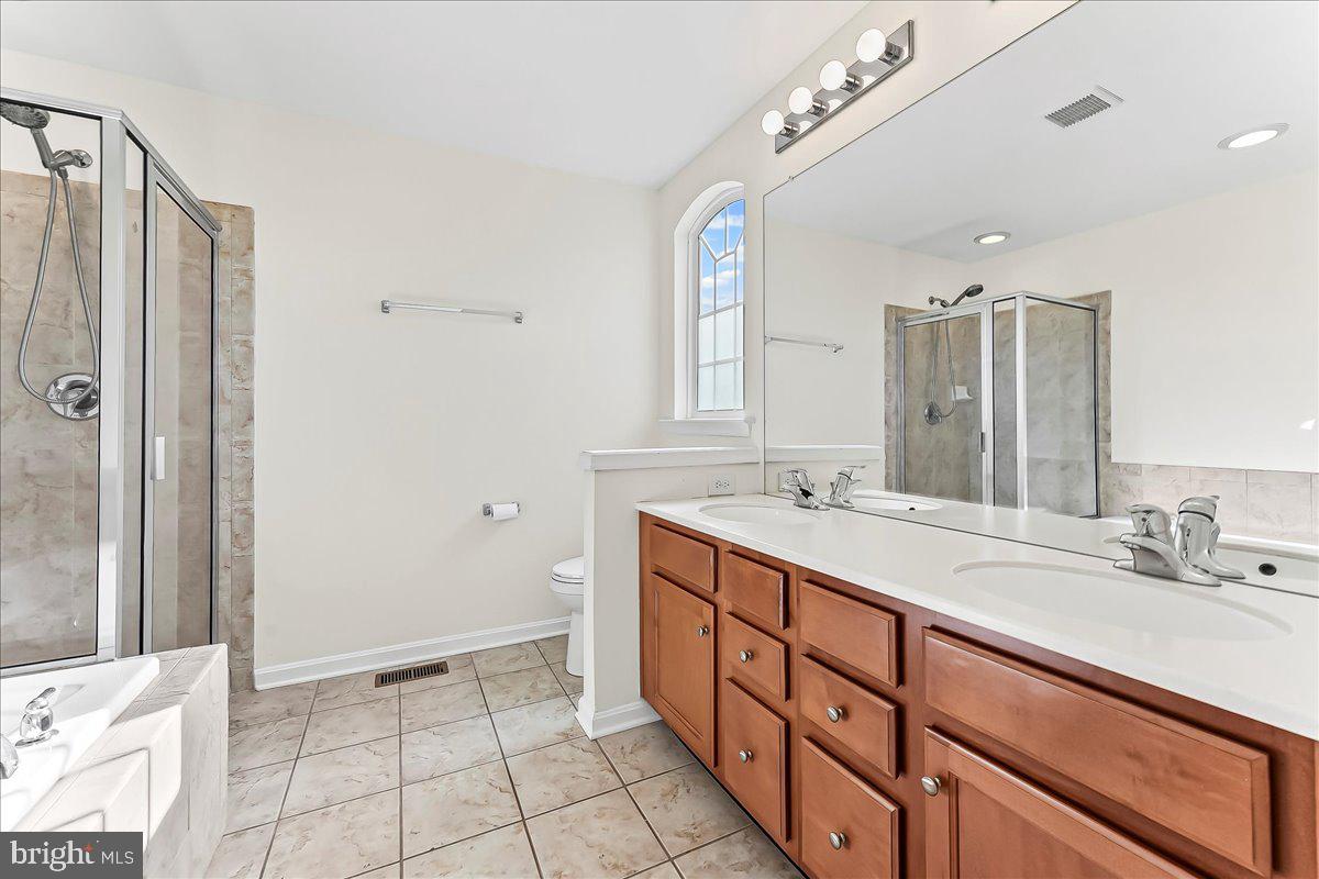 1910 Cavalier Lane Chester Springs, PA 19425 - Photo 24 of 32 a spacious bathroom with a double vanity sink mirror and double