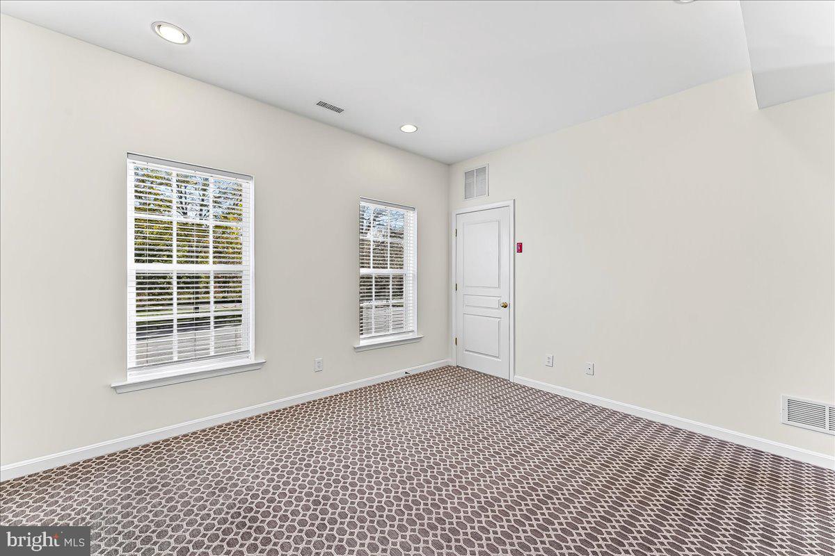 1910 Cavalier Lane Chester Springs, PA 19425 - Photo 6 of 32 a view of an empty room with a window
