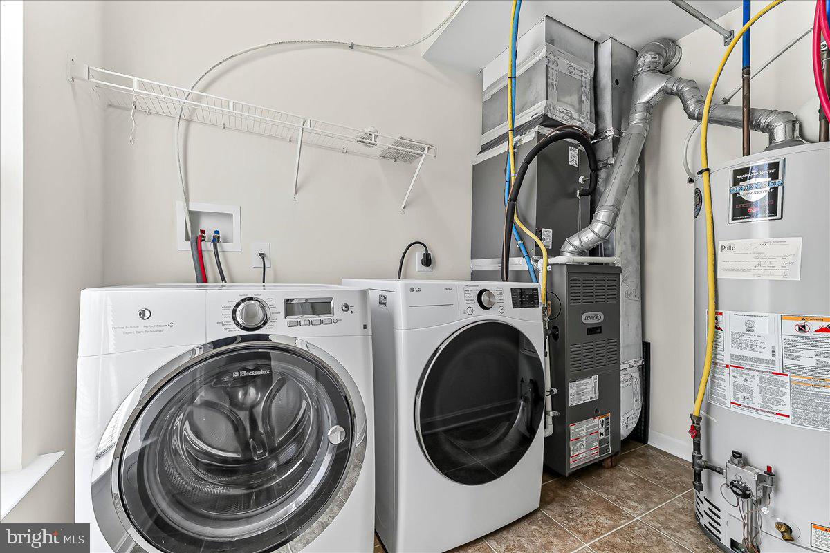 1910 Cavalier Lane Chester Springs, PA 19425 - Photo 7 of 32 a utility room with dryer and washer