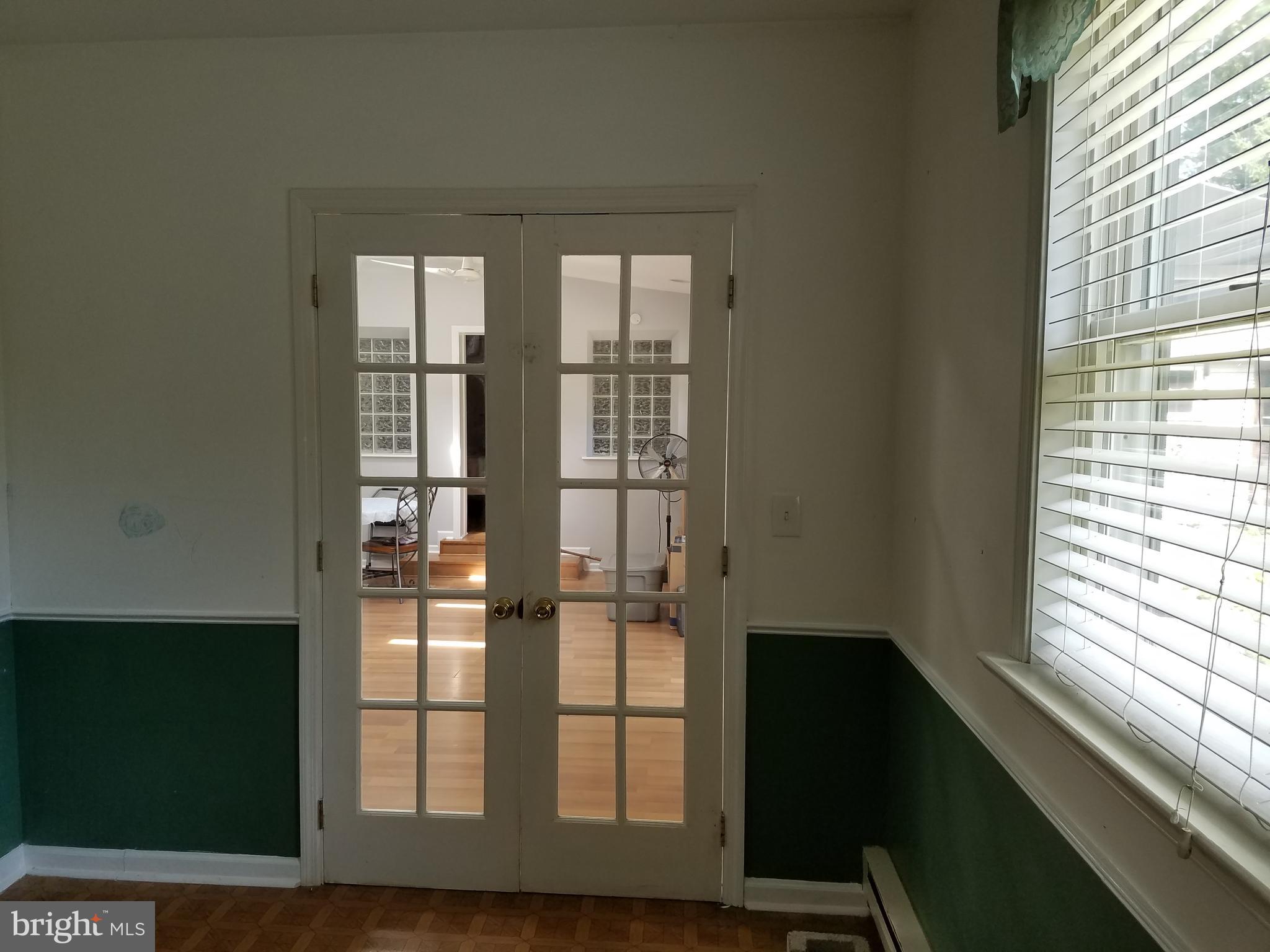 412 Foulke Road Ambler, PA 19002 - Photo 22 of 30 French Doors from BR 3 to Sun Room