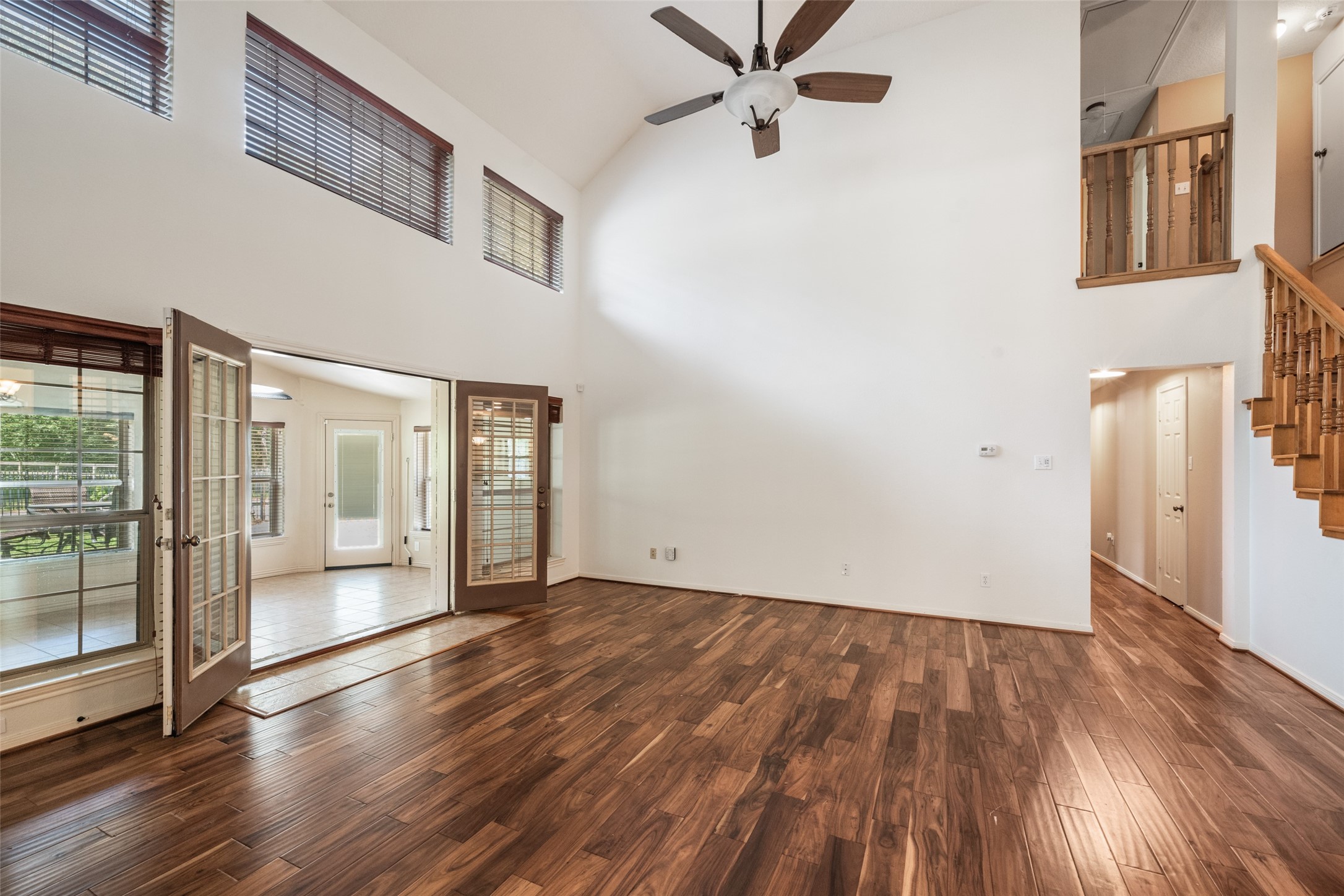 7863 Rodeo Road Waller, TX 77484 - Photo 14 of 36 wooden floor in an empty room with a window