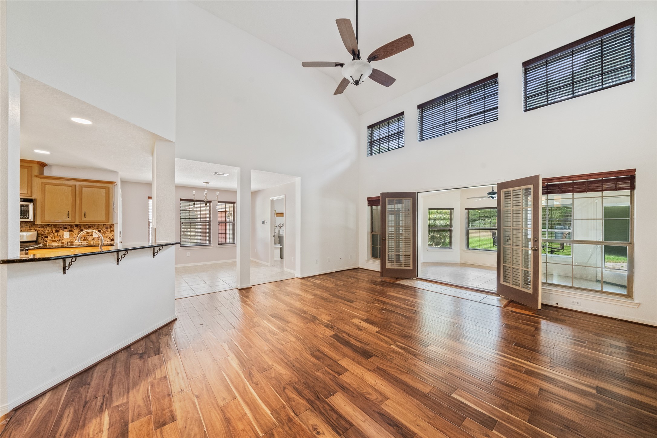 7863 Rodeo Road Waller, TX 77484 - Photo 16 of 36 a view of an empty room with wooden floor and a window