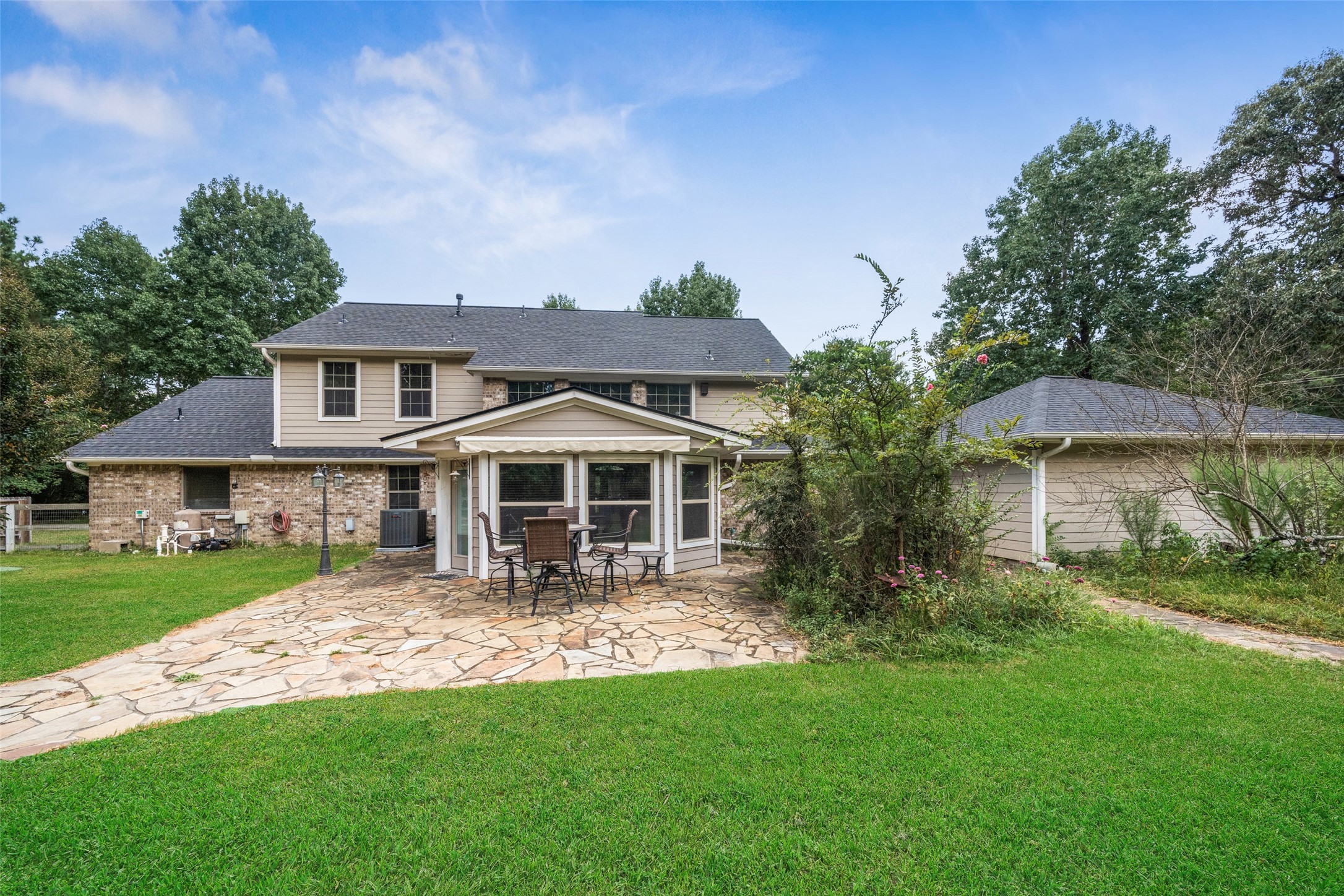 7863 Rodeo Road Waller, TX 77484 - Photo 28 of 36 a front view of a house with a garden