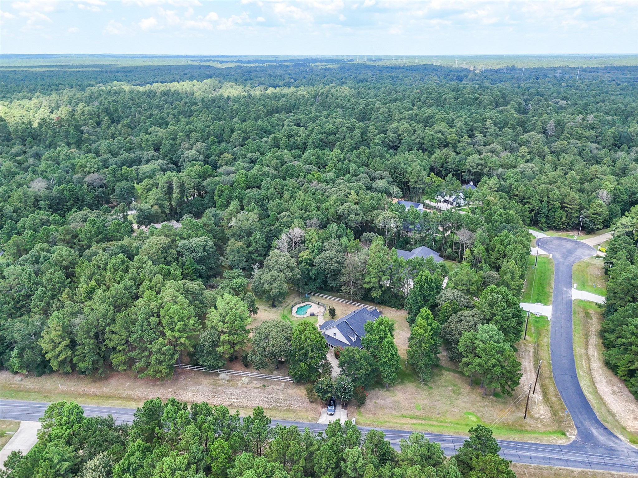 7863 Rodeo Road Waller, TX 77484 - Photo 32 of 36 an aerial view of residential house with outdoor space and trees all around