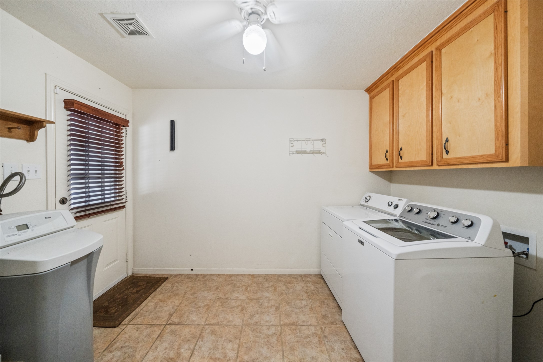 7863 Rodeo Road Waller, TX 77484 - Photo 33 of 36 a room with storage and utility