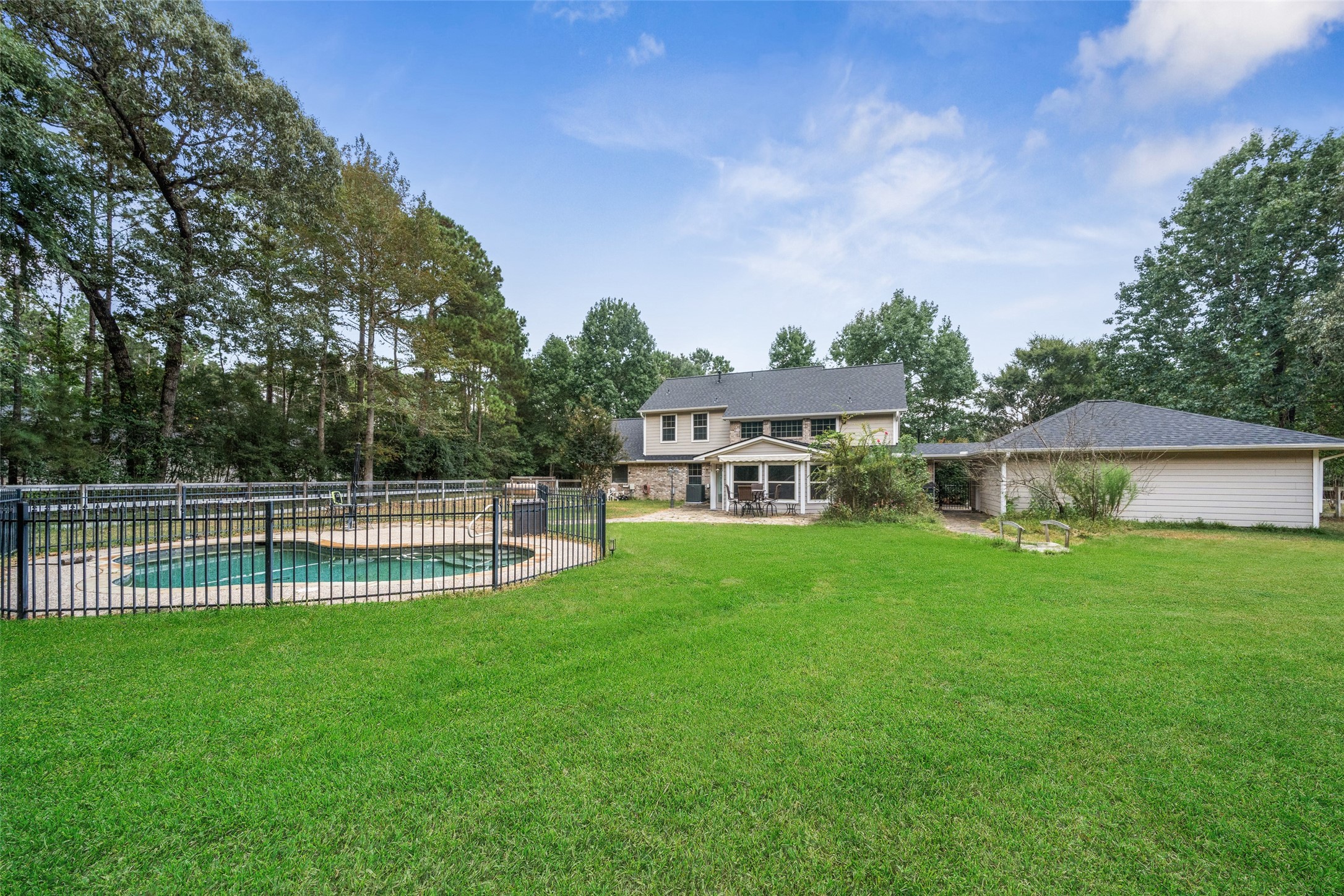 7863 Rodeo Road Waller, TX 77484 - Photo 5 of 36 a view of a house with a yard and sitting area