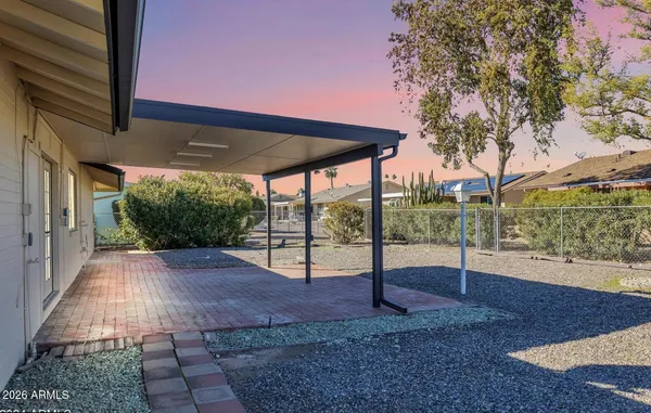 a view of a yard with a patio