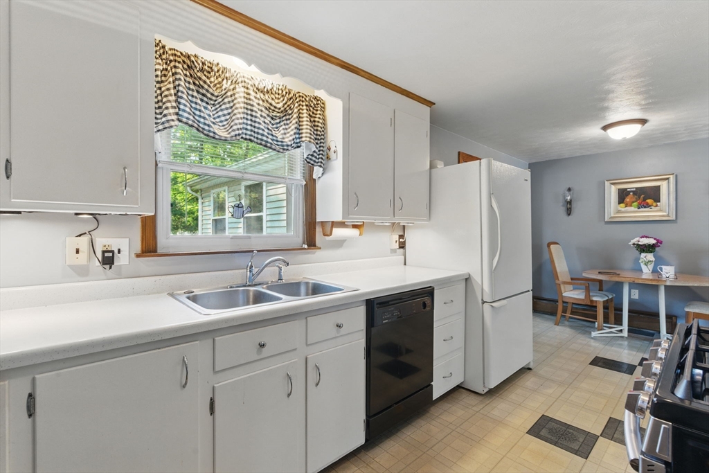 17 Howard Street Enfield, CT 06082 - Photo 8 of 33 a kitchen with a sink cabinets and window