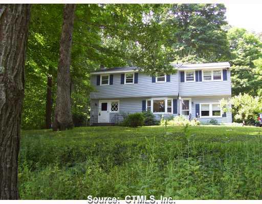 96 Millstream Road Hebron, CT 06231 - Photo 1 of 1 a front view of a house with a yard