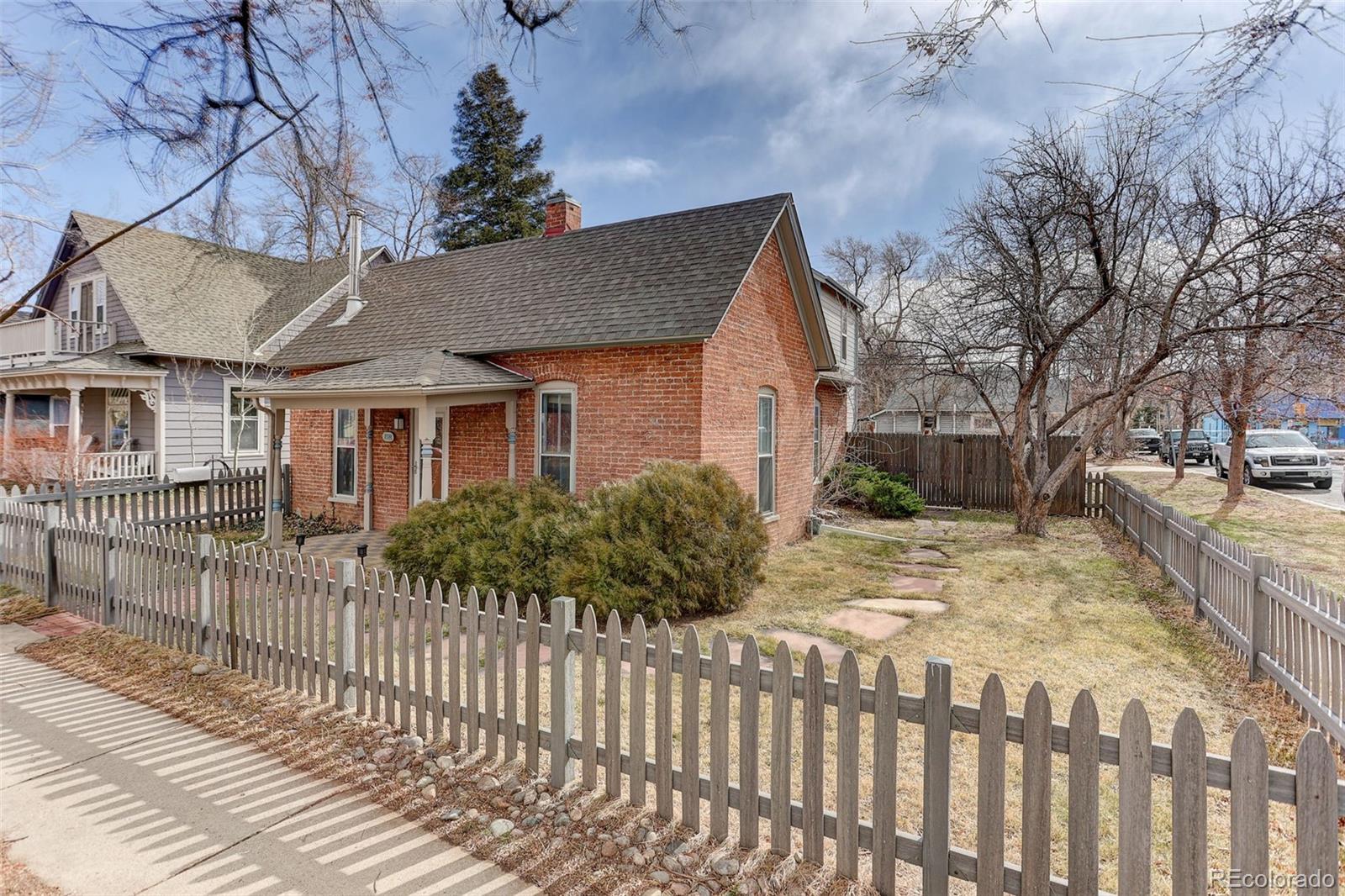 1902 Grove Street Boulder, CO 80302 - Photo 1 of 41 a view of a house with a yard