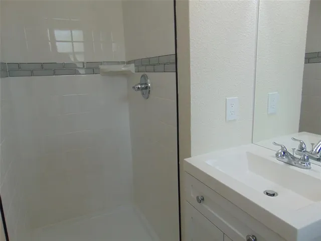 a bathroom with a sink and vanity