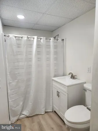 a bathroom with a toilet a sink and shower