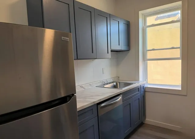 a kitchen with a sink and a window