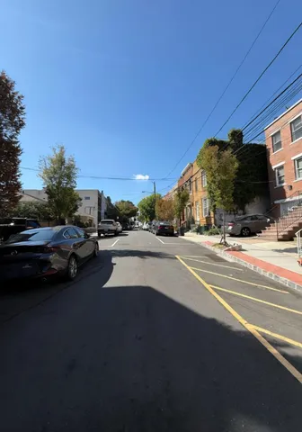 a view of street with parked cars