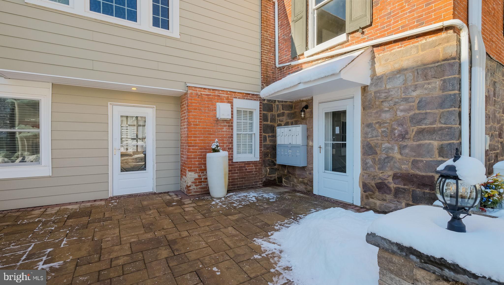 106 East State Street, Unit 4 Doylestown, PA 18901 - Photo 2 of 19 a view of a brick house with front door