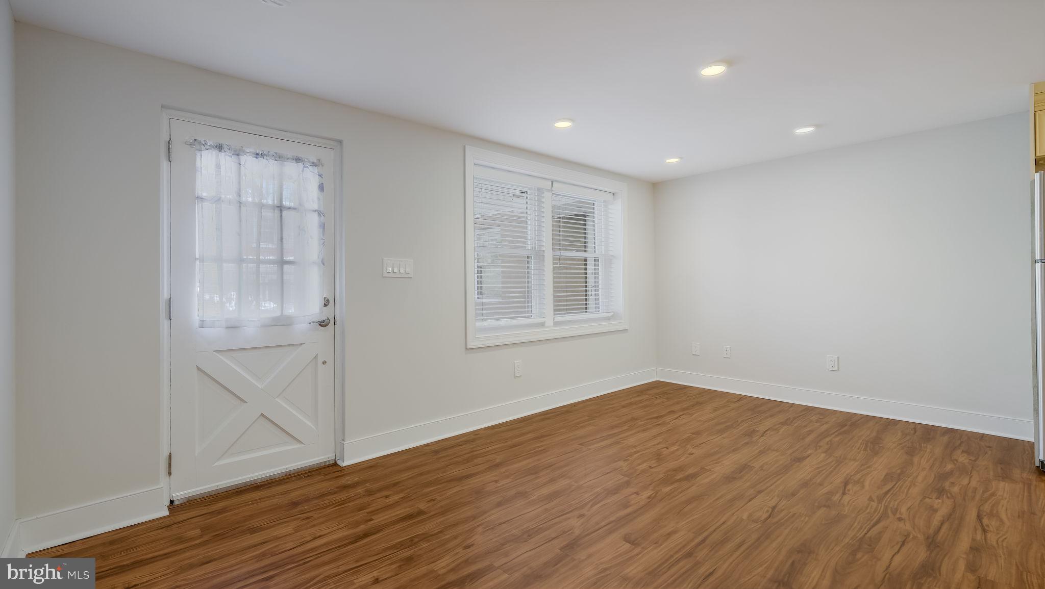 106 East State Street, Unit 4 Doylestown, PA 18901 - Photo 3 of 19 a view of empty room with wooden floor and fan