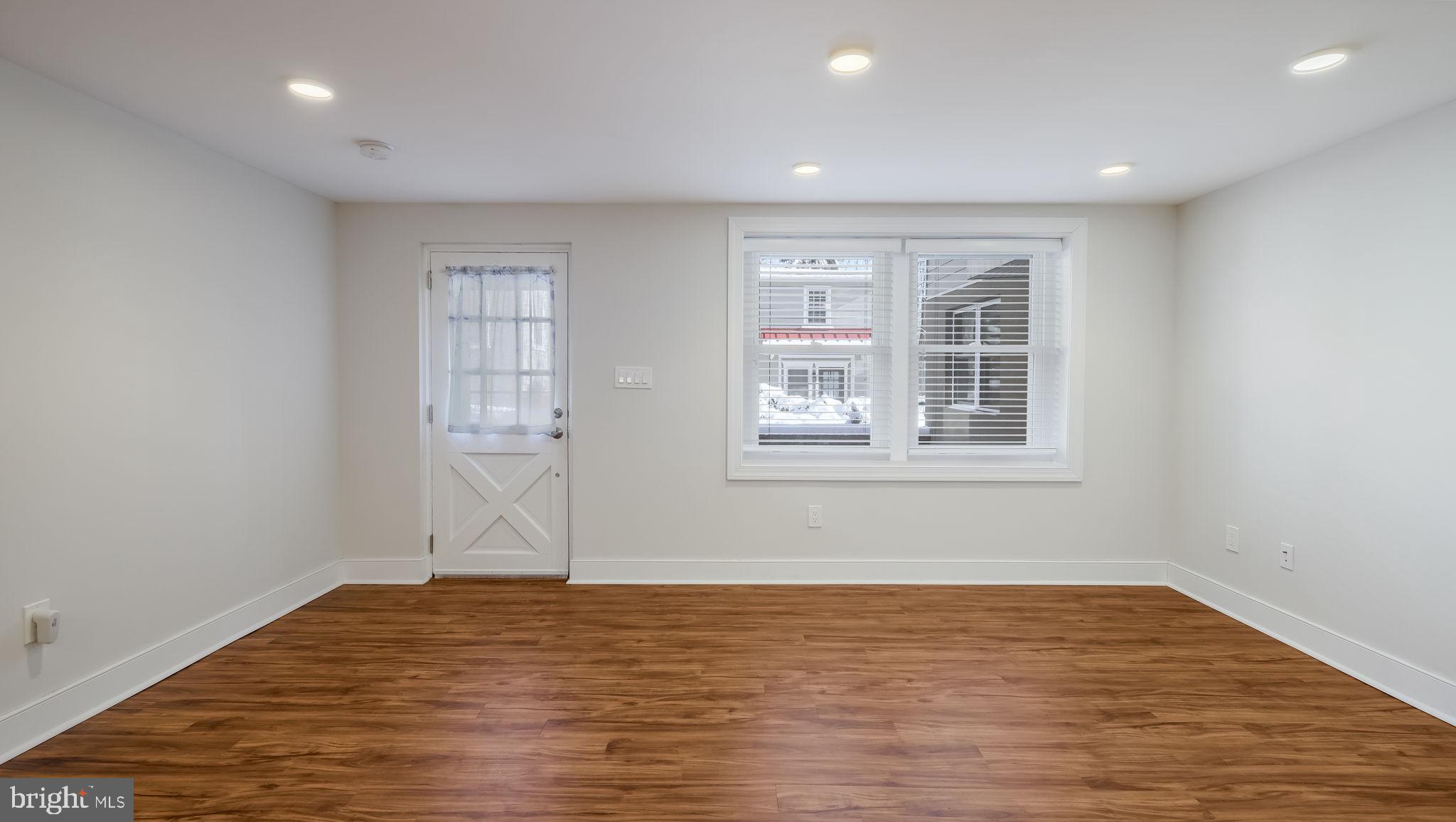 106 East State Street, Unit 4 Doylestown, PA 18901 - Photo 4 of 19 a view of empty room with wooden floor and fan