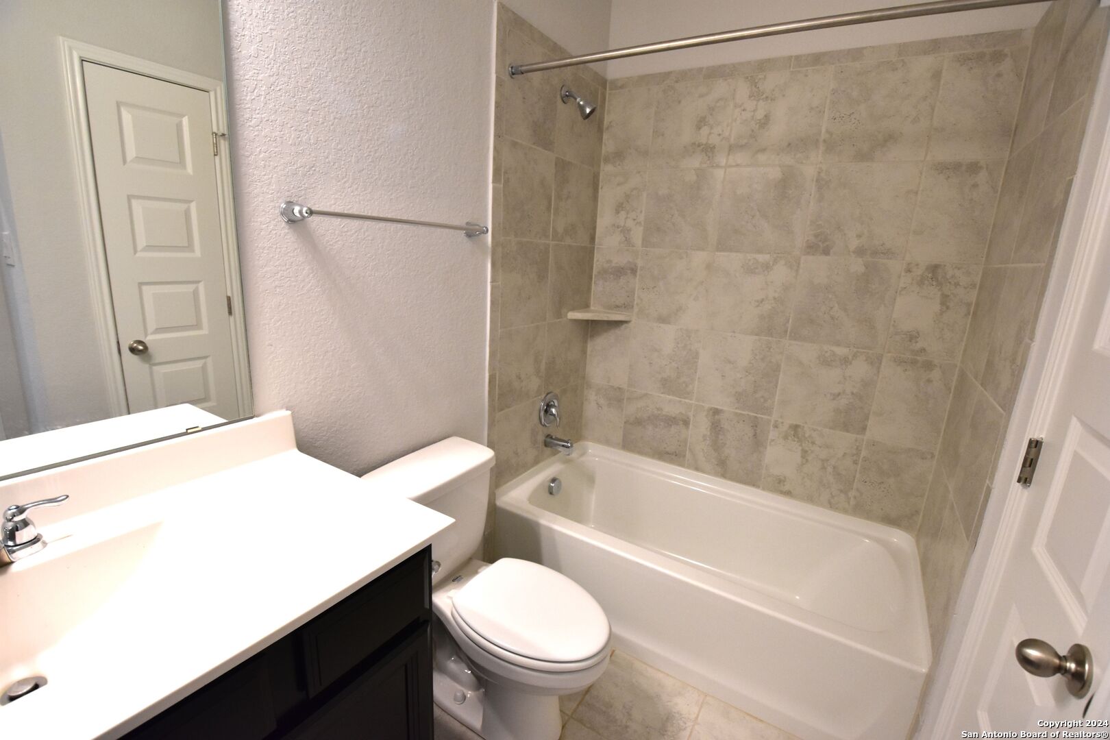 4923 Ranahan Pass St. Hedwig, TX 78152 - Photo 23 of 29 a bathroom with a sink a toilet and a bathtub