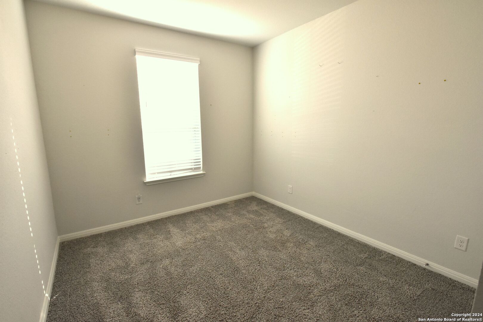 4923 Ranahan Pass St. Hedwig, TX 78152 - Photo 25 of 29 an empty room with a window