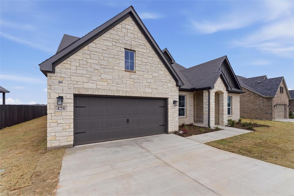 428 Guadalupe Lane Springtown, TX 76082 - Photo 4 of 29 a front view of a house with a yard