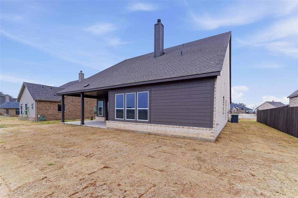 428 Guadalupe Lane Springtown, TX 76082 - Photo 7 of 29 a view of a house with a yard