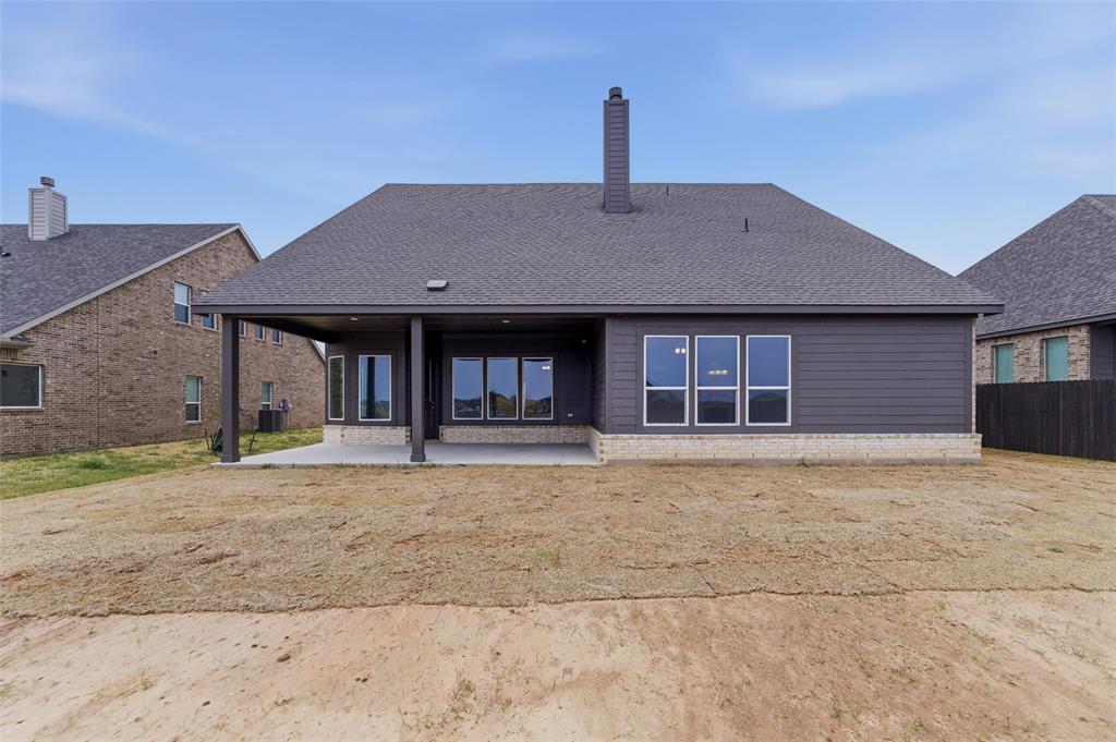 428 Guadalupe Lane Springtown, TX 76082 - Photo 8 of 29 a house view with a garden space