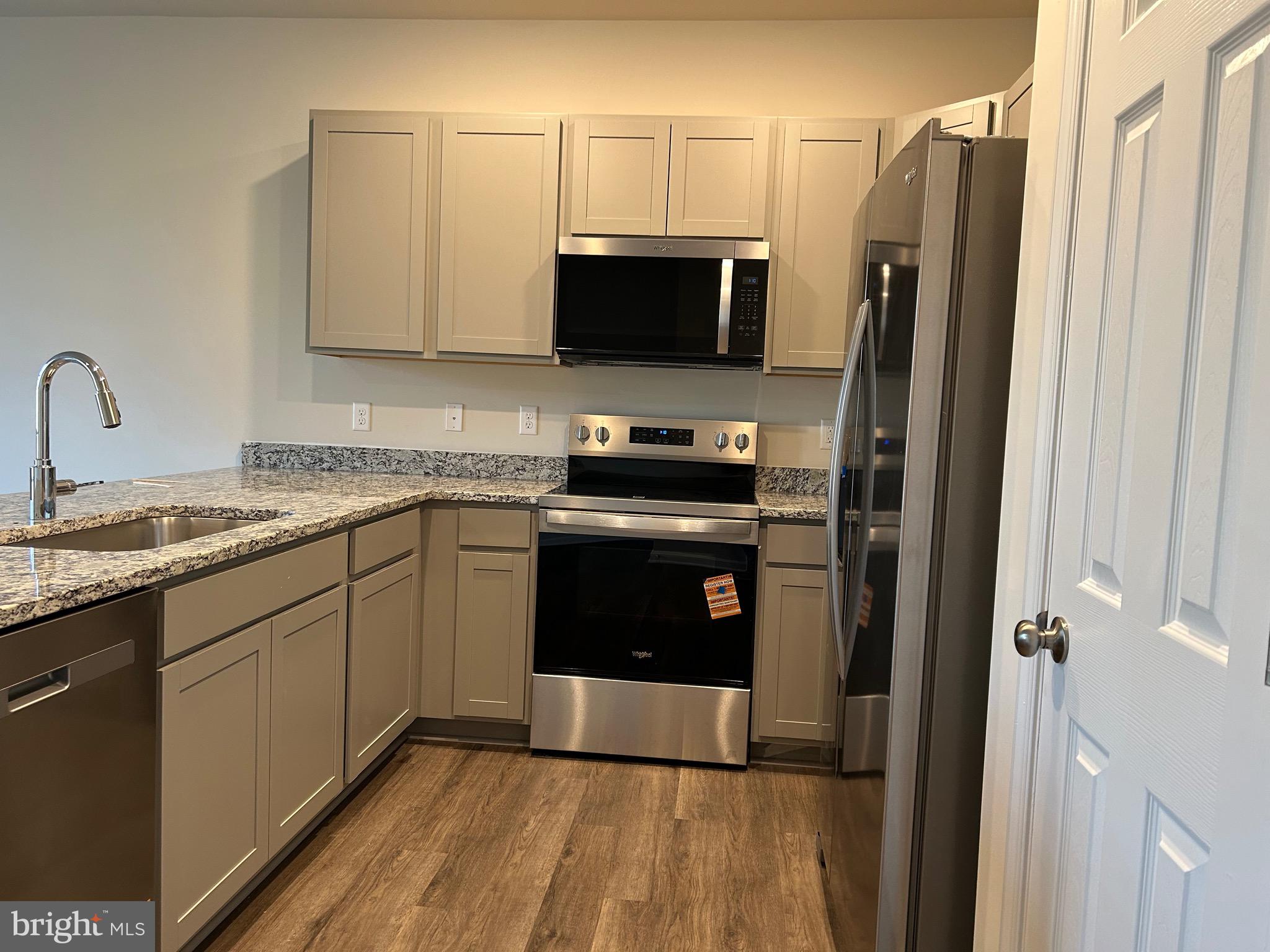 167 Rae Court Luray, VA 22835 - Photo 5 of 27 a kitchen with stainless steel appliances a stove a sink and a refrigerator
