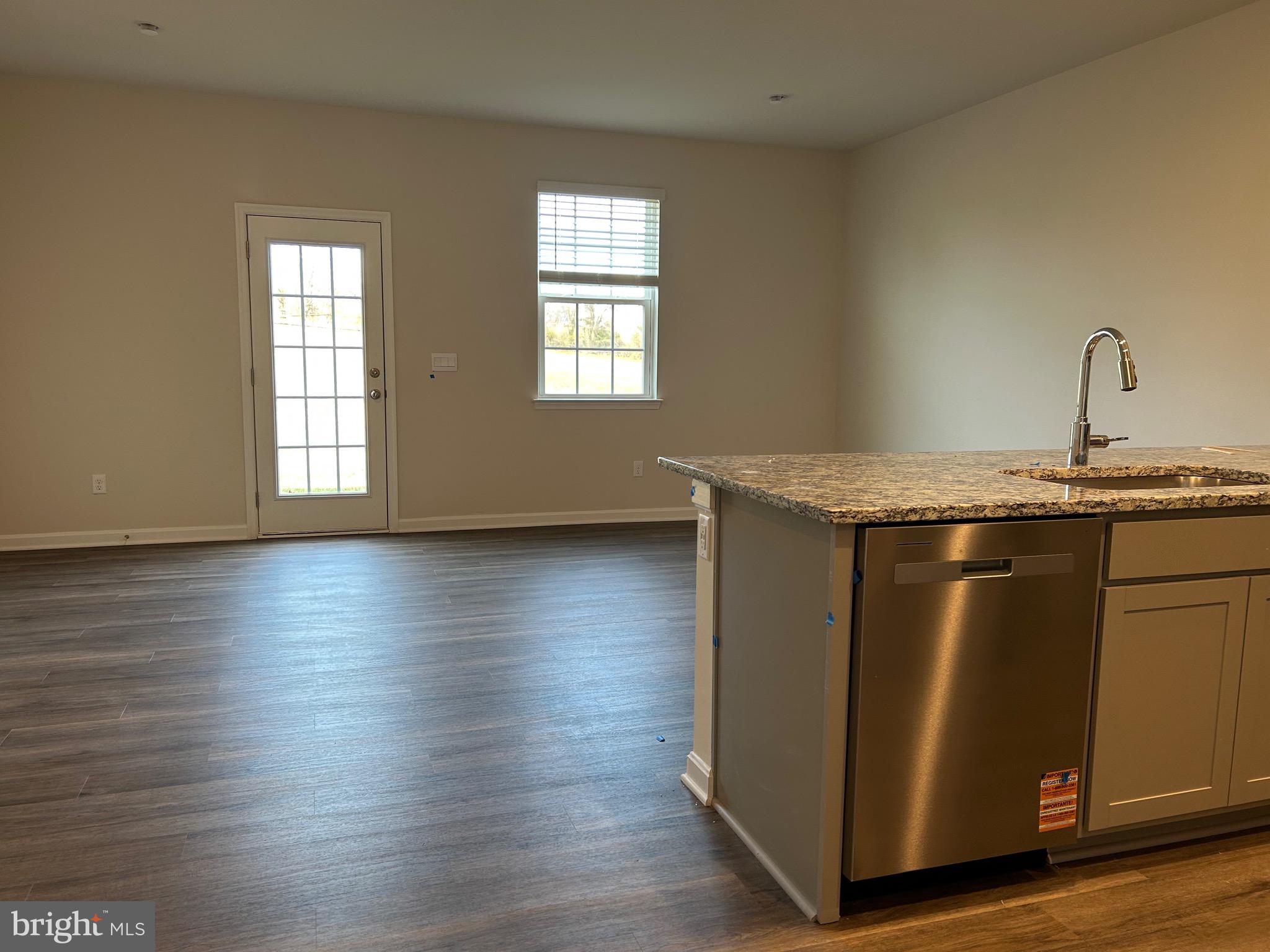 167 Rae Court Luray, VA 22835 - Photo 6 of 27 a kitchen with granite countertop wooden floors and a sink