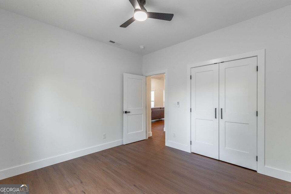 282 Glade Road Rossville, GA 30741 - Photo 12 of 20 a view of an empty room with wooden floor