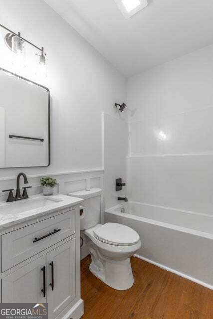 282 Glade Road Rossville, GA 30741 - Photo 13 of 20 a bathroom with a granite countertop toilet sink and mirror