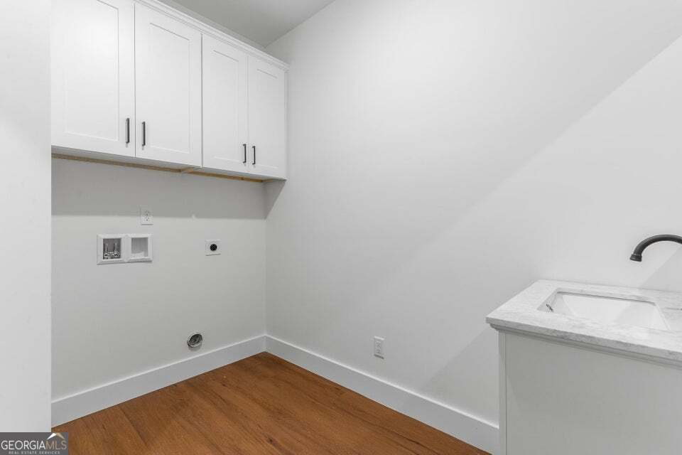 282 Glade Road Rossville, GA 30741 - Photo 16 of 20 a bathroom with a sink and cabinets