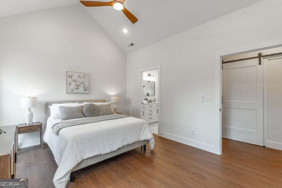 282 Glade Road Rossville, GA 30741 - Photo 17 of 20 a bedroom with a bed and wooden floor