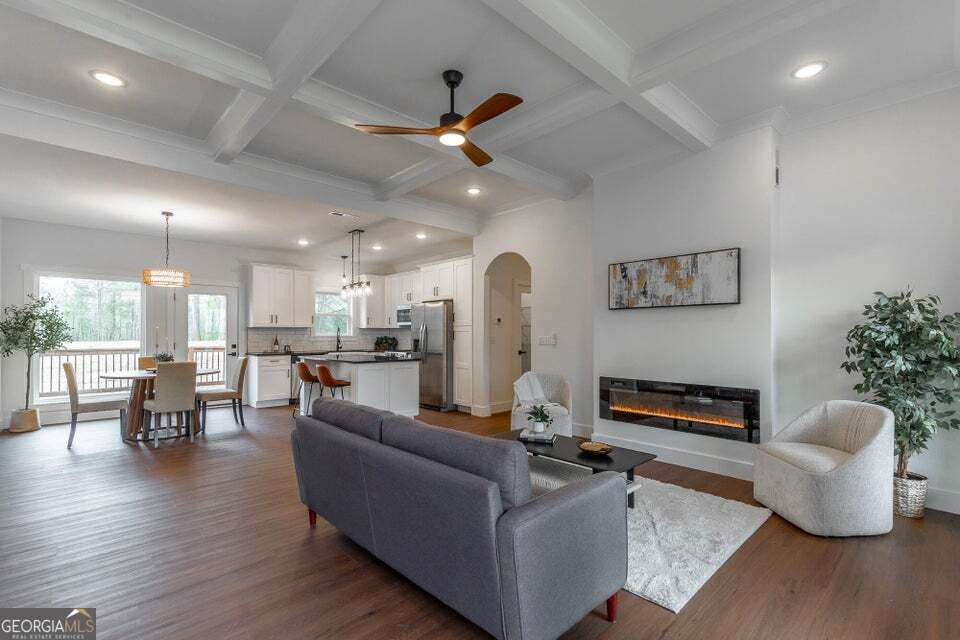282 Glade Road Rossville, GA 30741 - Photo 4 of 20 a living room with furniture kitchen view and a chandelier