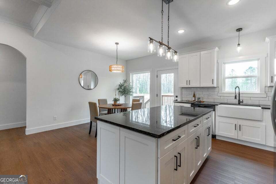 282 Glade Road Rossville, GA 30741 - Photo 8 of 20 a kitchen with granite countertop a sink a counter space appliances and cabinets