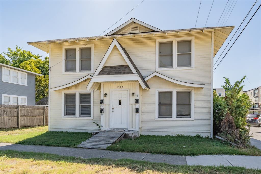 1509 Park Pl Avenue, Unit A Fort Worth, TX 76110 - Photo 1 of 13 a front view of a house with a yard and garage