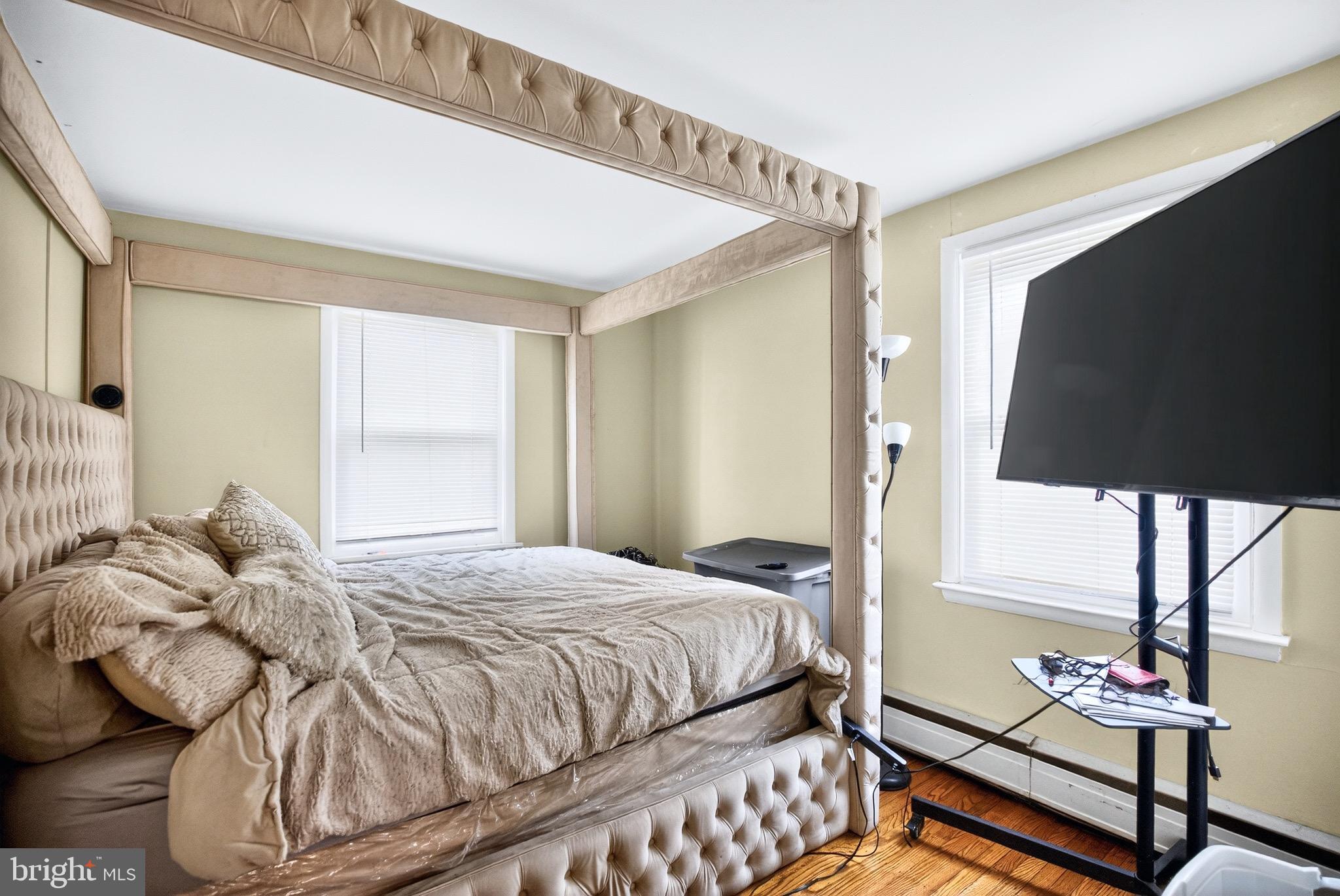 4401 Manayunk Avenue Philadelphia, PA 19128 - Photo 11 of 25 a bedroom with a bed and a flat tv screen